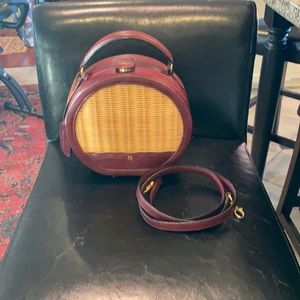 Etienne Aigner crossbody round bag with detachable strap.